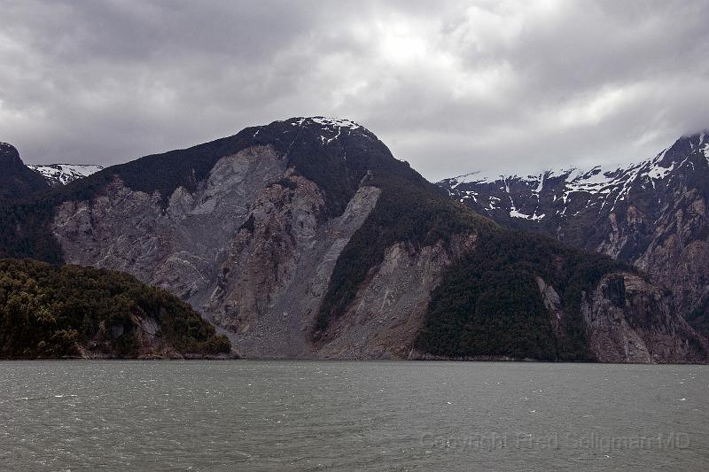 20071218 144304 D2X 4200x2800.jpg - Mountains on northern coast of inlet to Puerto Chacabuco. Note the deforested area which are the result of very recent (mid 2007) earthquake activity in Chile